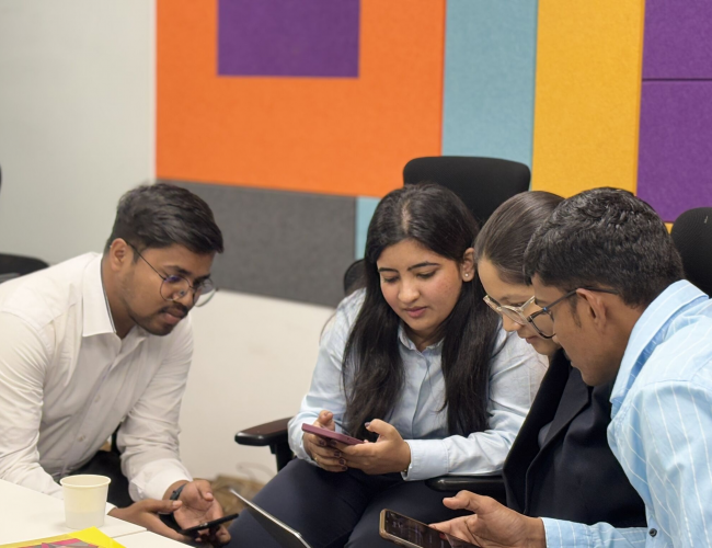 Elevate 2025 members discussing about an activity at Induction Programme